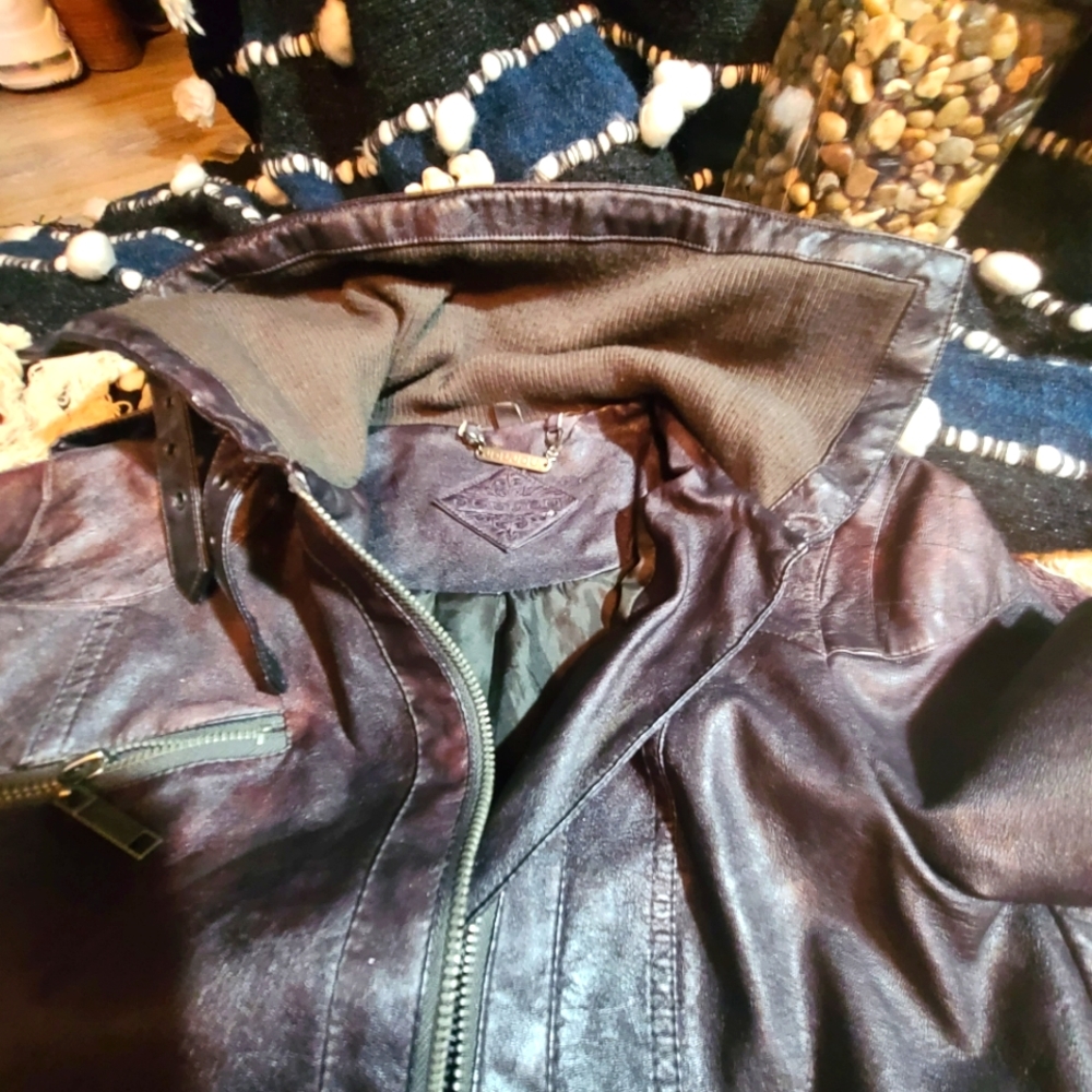 Black with a tint of brown leather  motorcycle  jacket